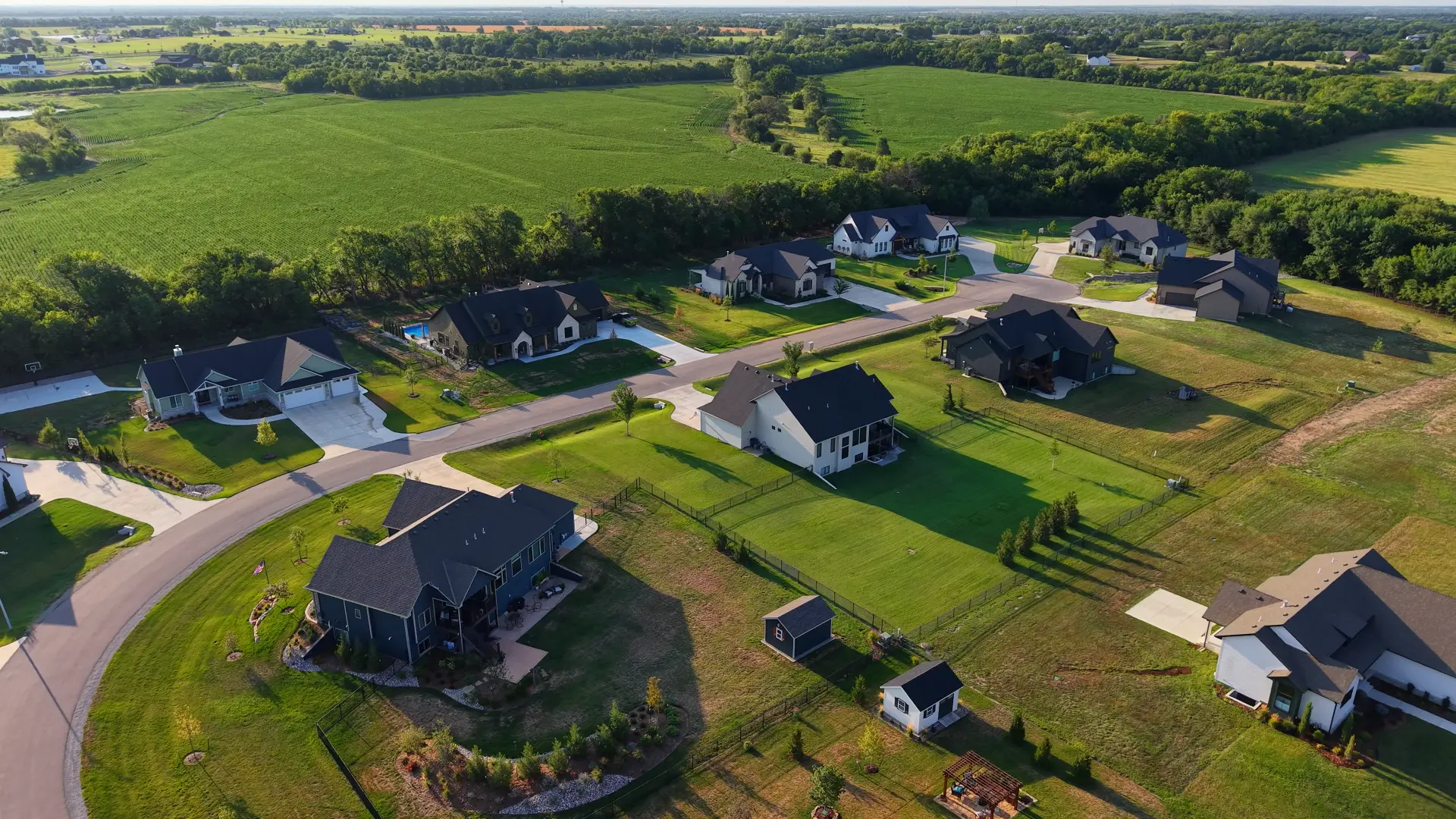 Aerial view of a Cedar Ranch Estates street with completed custom homes